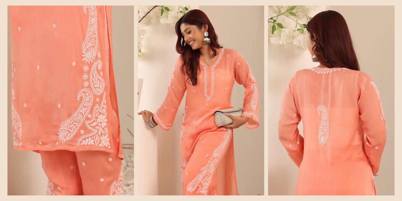 A woman showcasing the white floral chikankari embroidery on orange kurta set